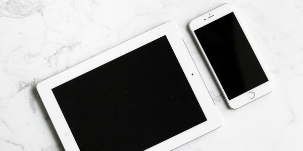 white iPad and silver iPhone 6