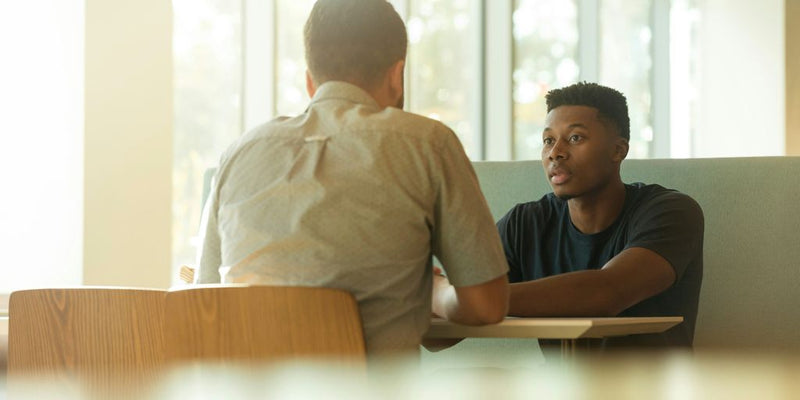 two men talking