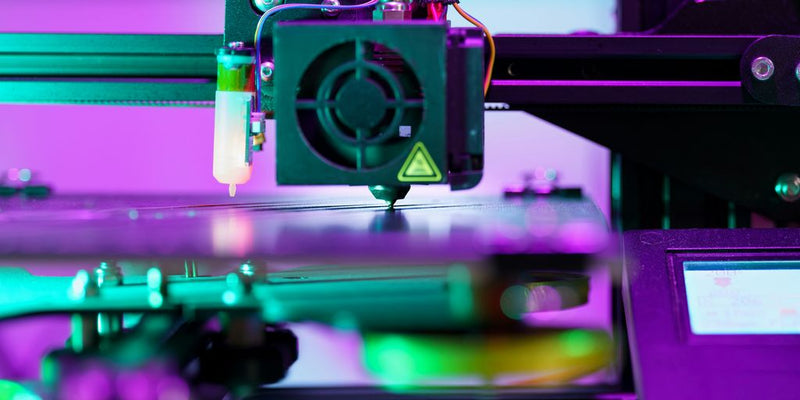 A close up of a machine with a purple background