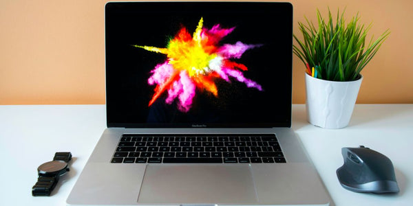 MacBook Pro showing purple illustration