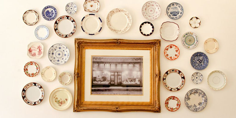 photo frame near assorted-color ceramic dishes