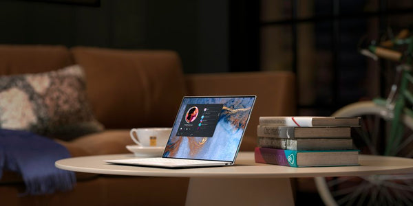 laptop on brown wooden table